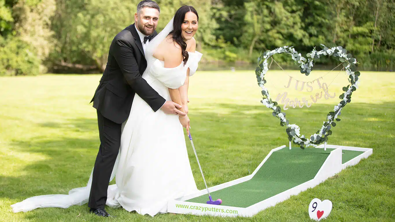 Becky and Daniel playing wedding crazy golf at That Amazing Place Essex Exclusive wedding venue